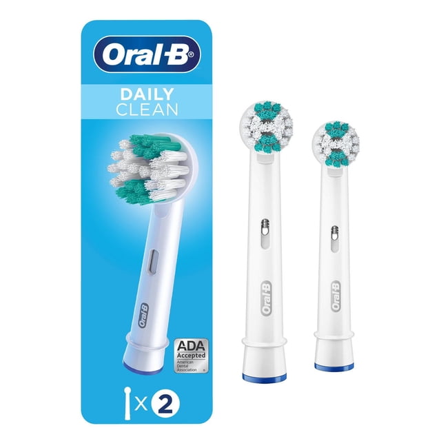Oral-B Daily Clean Electric Toothbrush Replacement Brush Heads featuring two white round brush heads with soft multicolour bristles designed for plaque removal and gum health, displayed alongside blue packaging with Oral-B logo and ADA Seal of Acceptance, compatible with most Oral-B rechargeable toothbrush handles.