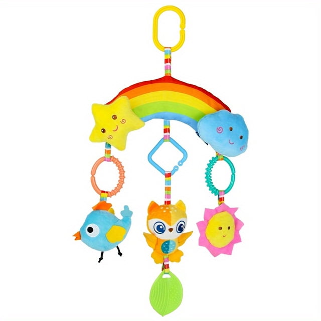 Rainbow Soothing Plush Toy Car Hanging Bed Bell Soothing Toy by GRM, featuring a colorful rainbow design with attached plush characters including a star, cloud, bird, owl, and sun. Made of cloth, suitable for ages 0-3 years. Includes a yellow clip for easy attachment to cribs or car seats.