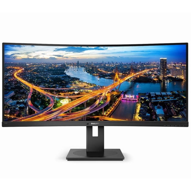 Philips 346B1C 34" Curved UltraWide LCD Monitor with USB-C and QHD Resolution displaying a vibrant cityscape at dusk with illuminated highways and a river, featuring a curved 34-inch VA panel with 3440 x 1440 QHD resolution and wide viewing angles. Equipped with USB-C, HDMI, DisplayPort, and built-in speakers on a black adjustable stand, ideal for multitasking and immersive viewing.