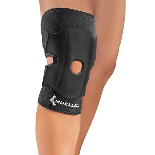 Mueller Sports Medicine Adjustable Knee Support, OSFM, black knee brace with open patella design, worn on a leg. Provides compression and support for sore, weak, injured, and arthritic knees. Lightweight at 0.44 pounds.