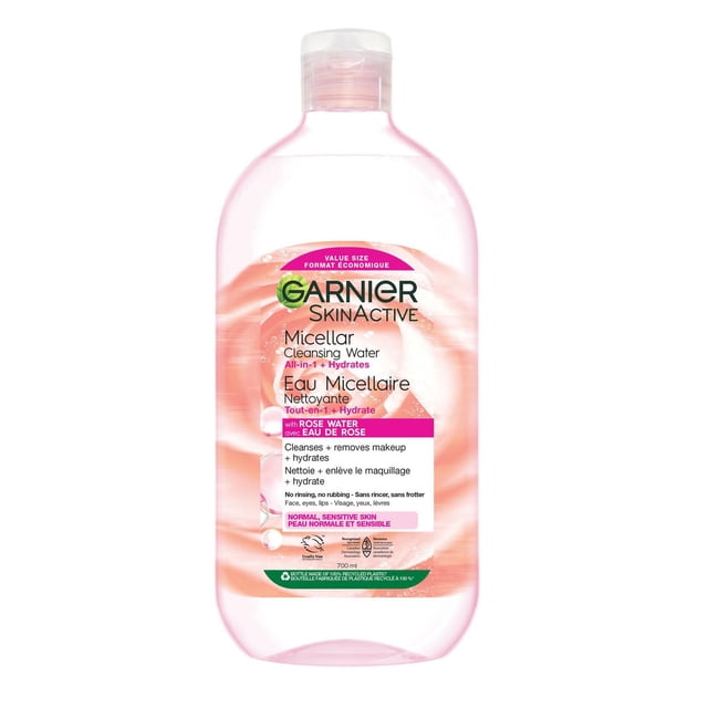 Garnier Micellar Water Makeup Remover All-In-One Cleanser With Rose Water in a 700 ml clear plastic bottle with pink liquid and flip-top cap, formulated for normal sensitive skin to cleanse, hydrate, and gently remove makeup without rinsing or rubbing.