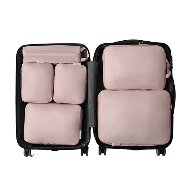 TopLLC Compressed Travel Six Piece Set with large capacity storage bags displayed inside an open suitcase. The set includes six pink storage bags of varying sizes, designed for clothing, shoes, and toiletries. These bags are made of memory cloth, offering compression to save 40% space and classified storage for organized travel. The suitcase is black, highlighting the modern and functional design of the storage bags.