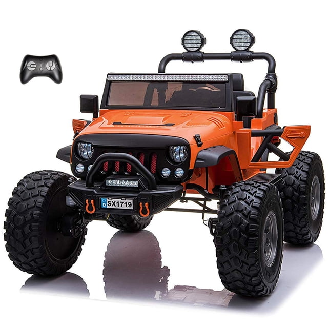 VOLTZ TOYS Lifted Monster Jeep 24V 2 Seater Classic Ride on Car with Remote Control, featuring an orange Jeep Wrangler design with lifted suspension, durable rubber tires, and openable doors. Includes two premium leather seats, LED headlights, and a built-in music player. Powered by a 24V rechargeable battery with 4 motors for off-road performance. Comes with a parental remote control for added safety.