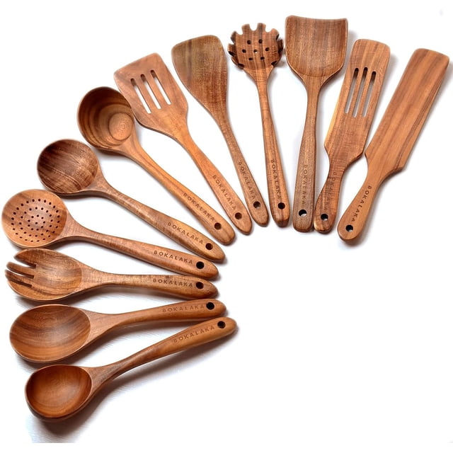 Wooden Spoons for Cooking, 12 Pack Wooden Kitchen Utensils Set by BOKALAKA crafted from natural teak wood. Includes spatulas, slotted spoons, salad fork, pasta spoon, and more, arranged in a fan-like display. Heat-resistant and safe for non-stick cookware, each utensil features a smooth finish and a hole for hanging storage.