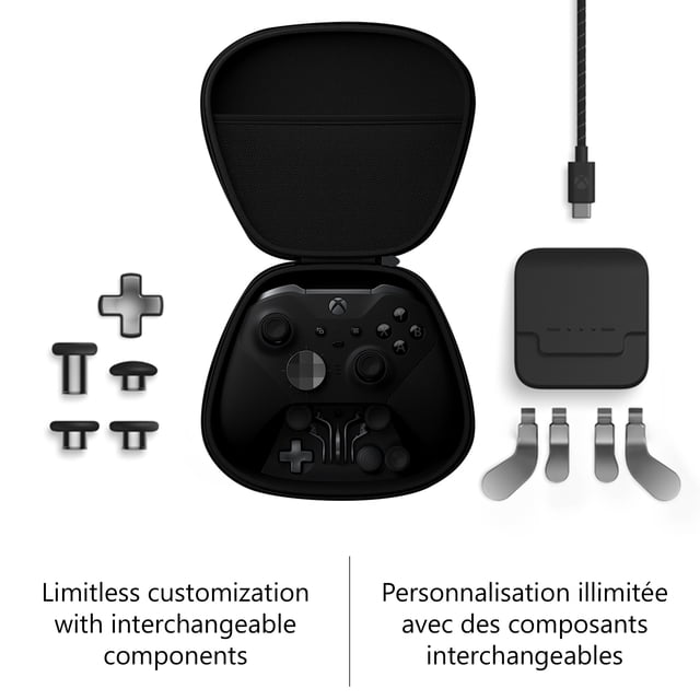 Xbox Manette Sans Fil Elite Série 2 (Xbox One) dans une Étui de Transport Noire Ouverte avec Joysticks Interchangeables, Pavé D et Palettes Disposés Autour, plus un Câble de Recharge USB-C et une Station de Recharge, Mettant l'Accent sur des Composants Personnalisables pour Jeux Professionnels.