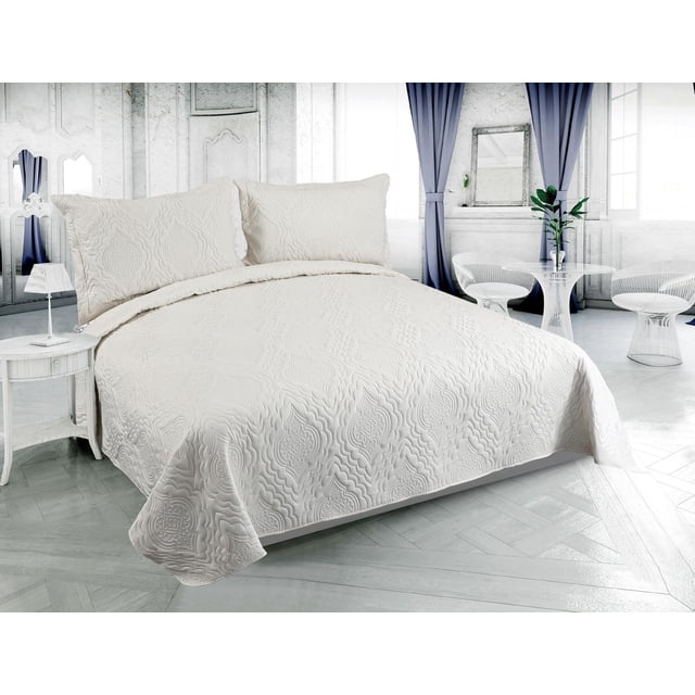 Marina Decoration Solid Embossed Pinsonic Coverlet Bedspread Bedding Ultra Soft Summer Quilt Set with Shams, Cream Color front-facing view of a cream embossed coverlet on a bed showing raised pinsonic texture and stitched channel quilting; reversible brushed microfiber surface with matching pillow sham at head; lightweight, all-season quilt often used as a bedsheet or light blanket.