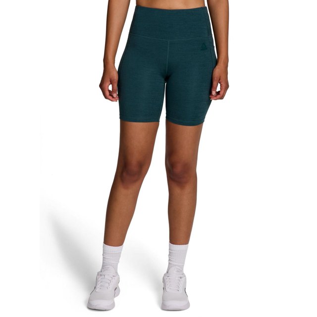 Reebok Short Taille Haute pour Femmes Reflex en Tissu de performance Chiné Bleu Sarcelle Foncé avec Technologie d'Évacuation de l'Humidité, Montré à l'Avant sur un Modèle de la Taille Jusqu'au Milieu de la Cuisse, avec une Ceinture Ajustée à Taille Haute, des Poches Latérales, des Coutures Actives et un Subtil logo Reebok sur la Jambe Gauche, Assorti aux Chaussettes Montantes Blanches et aux Chaussures Athlétiques Blanches, Convient pour l'Entraînement Ou les Tenues Décontractées.