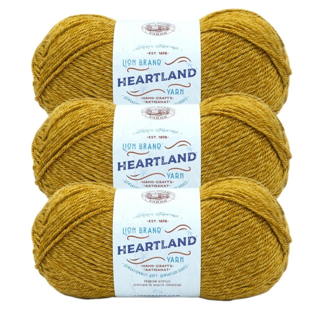 Lion Brand Yarn Heartland Yarn 3Pack featuring three skeins of medium worsted weight acrylic yarn in mustard yellow, each wrapped with a white label displaying the Heartland logo and care details, suitable for knitting, crochet, and home décor crafts.