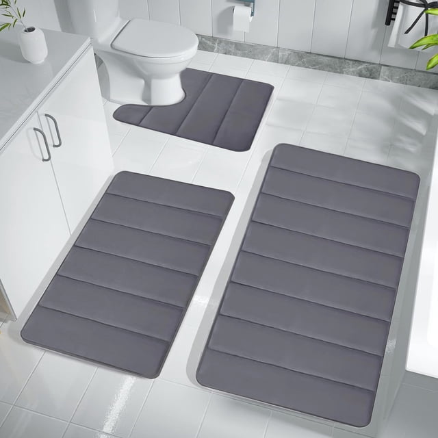 Meitianfacai Bathroom Rug Sets for Bathroom Floor, a 3-piece set in dark gray memory foam designed for kids' bathrooms. Includes a toilet mat, bath mat, and floor mat with water absorption, non-slip backing, and quick-drying features. Machine washable and soft for comfortable foot support.