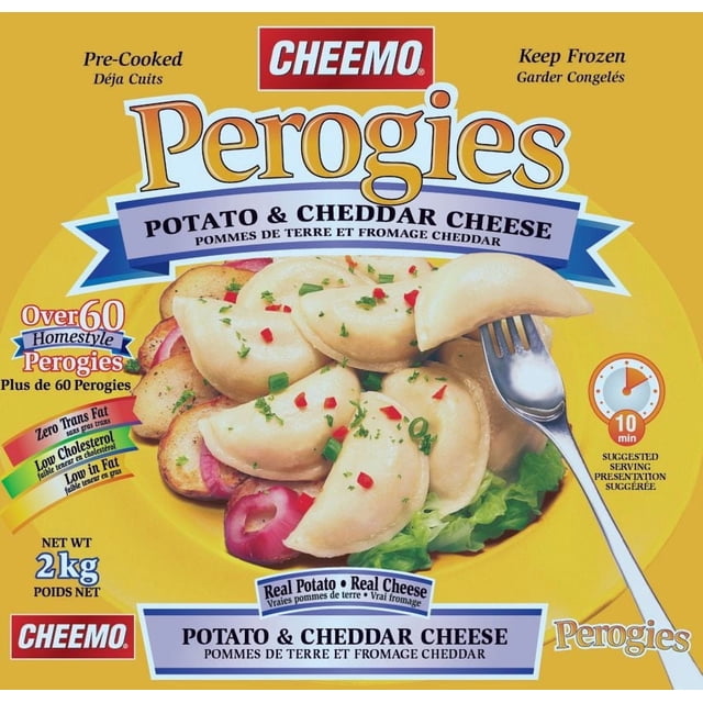 Cheemo Potato And Cheddar Cheese Perogies 2 kg package showing cooked frozen homestyle perogies filled with real potatoes and cheddar cheese, garnished with chopped herbs and red pepper flakes on lettuce and sliced potatoes, with a fork holding one perogy, highlighting zero trans fat and low cholesterol.
