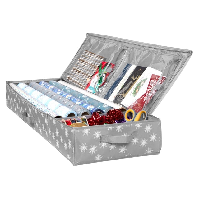 Wrapping Paper Storage Container by HOLDN' STORAGE, designed to fit up to 27 rolls of 1 3/8” diameter or 12 rolls of 2” diameter, with a maximum roll length of 40 inches. Made from durable 600D material, this underbed organizer features a grey exterior with a snowflake pattern, sturdy handles, and zippers. The open container displays neatly arranged wrapping paper rolls, ribbons, bows, scissors, and other gift-wrapping accessories, with clear interior pockets for additional storage. Dimensions: 41.25 x 14.25 x 5.5 inches.