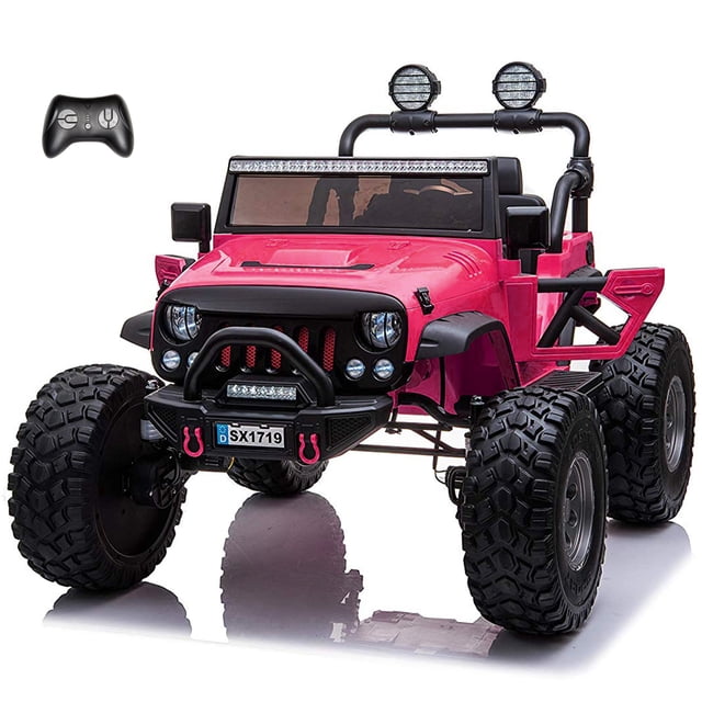 VOLTZ TOYS Lifted Monster Jeep 24V 2 Seater Classic Ride on Car with Remote Control, featuring a bold pink design with lifted suspension and large rubber tires for off-road play. This ride-on Jeep includes two premium leather seats, openable doors, LED headlights, and a built-in music player. Powered by a 24V rechargeable battery and 4 motors, it offers smooth performance on grass, gravel, and other terrains. The parental remote control ensures added safety for kids aged 3–8 years.