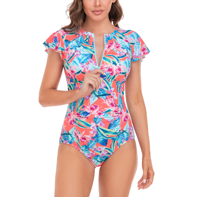 BIMEI Women One-Piece Rash Guard Zip Front Mastectomy Swimsuit in red with a vibrant floral print. Features short sleeves, a zippered front for easy access, and pocketed cups for prosthesis support. Made of 82% nylon and 18% spandex, offering tummy control and UV protection. Suitable for swimming, surfing, and water sports. Size M.