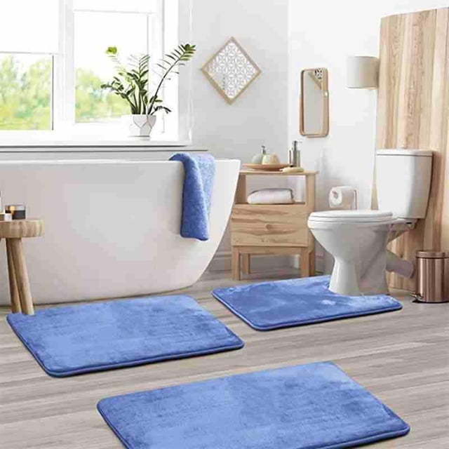 Bathroom Rugs Sets 3 Piece, including a soft absorbent bath mat, a U-shaped toilet rug, and a shaggy bath mat, displayed in a modern bathroom setting. The mats are crafted from absorbent coral velvet material in a vibrant blue color, featuring non-slip backing for stability. The set includes three pieces designed for versatile use around the toilet and bathroom floor, enhancing both functionality and style.