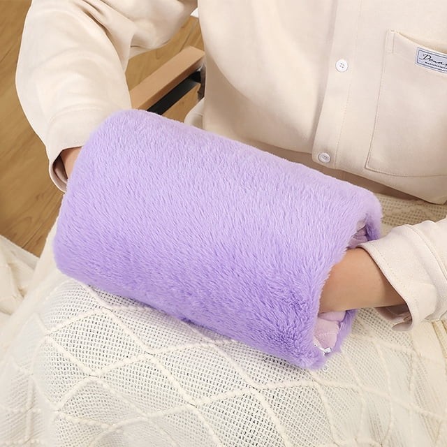 Meitianfacai Hand Warmer Hand Warmer Bag in a solid purple color with a plush, removable, and washable cover. This USB electric heating hand warmer offers fast and stable heating, with a lightweight design suitable for both indoor and outdoor use. The image shows the hand warmer being used, highlighting its compact size and cozy texture.