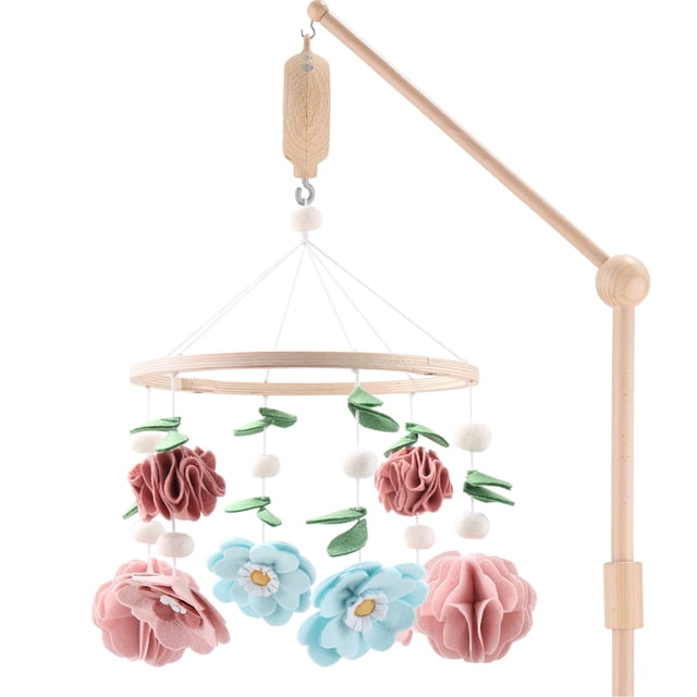 The Peanutshell Wildflower Baby Musical Wooden Crib Mobile featuring a wooden frame with hanging felt flowers and leaves in pink, aqua, and green. Includes a digital music box that plays 12 soothing lullabies on a 3-minute loop. Designed to promote visual, auditory, and motor development, this mobile is ideal for a girl's nursery. Requires two AA batteries (not included).