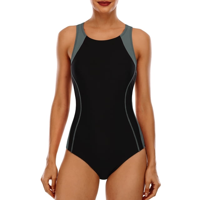 Charmo Women's Sports One Piece Swimsuit Racerback Boyleg Swimwear in a black and grey design. Features a racerback style with wide shoulder straps and a keyhole back for freedom of movement. Includes a built-in wirefree padded shelf bra with elastic underbust band for support and shaping. Made from quick-drying fabric with 82% nylon and 18% spandex for solid colors. Designed with contrast color splicing at the waist and leg cut for a sporty look. Suitable for swimming, training, and beach activities.