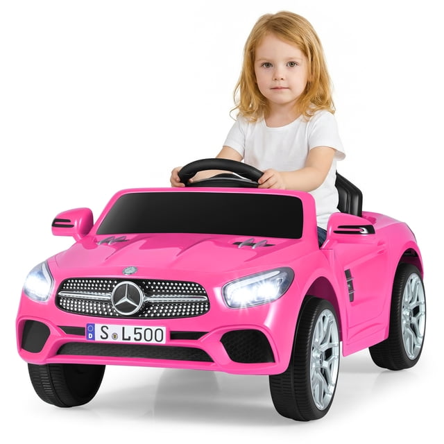OLAKIDS 12V Electric Kids Ride On Car, Licensed Mercedes Benz SL500 Toy Car with Remote Control, MP3 Plug, USB, 2 Speeds, LED Lights, Battery Powered Toy Vehicle for Toddler Children front-facing studio view of a white licensed Mercedes Benz SL500 ride‑on with both openable doors, simulated instrument and multimedia panel with USB and TF card slots and MP3 input, rotatable steering wheel, visible seat belt and pedals, four wear-resistant wheels with front and rear spring suspension and small transport wheels underneath, bright LED headlights and taillights, parental 2.4GHz remote control mode and two speeds shown; overall 37.5" x 22.5" x 18" (95 x 57 x 46 cm), max load 66 lbs (30 kg). Often used to introduce toddlers to steering and basic vehicle play.