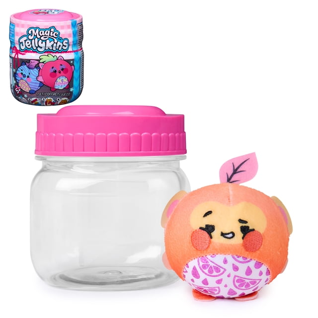Magic Jellykins Surprise Plush Jar with a pink screw-on lid and clear plastic body, shown with a 3-inch orange plush toy featuring embroidered eyes, smiling mouth, red cheeks, a pink leaf on top, and a purple citrus slice pattern on its belly, a water-activated, food-themed collectible sensory toy for kids aged 5 and up, ideal for fidgeting and stress relief.