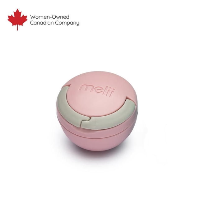 melii Pacifier Pod in soft pink with a round, compact design and grey latch, serving as a hygienic pacifier case that hooks onto bags or strollers for quick access and clean storage.