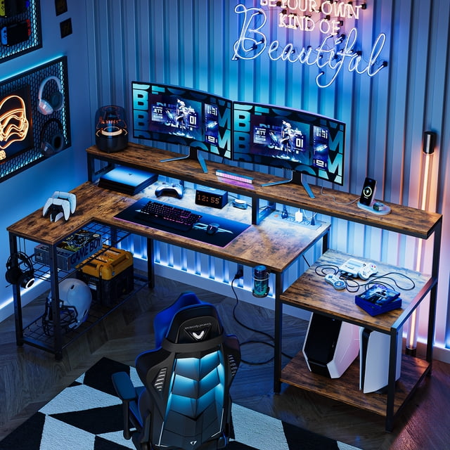 Bestier 71.5 inch Computer Desk with Power Outlets, L Shaped Home Office Desk with Monitor Stand in rustic brown. The desk features a spacious L-shaped design with a 71.5-inch length, ergonomic monitor stand, and RGB LED lighting. It includes 4 AC outlets and 2 USB ports for powering multiple devices. The desk has customizable storage shelves, a foldable cup holder, and a headphone hook. The setup includes dual monitors, gaming accessories, and a gaming chair in a modern, illuminated room.