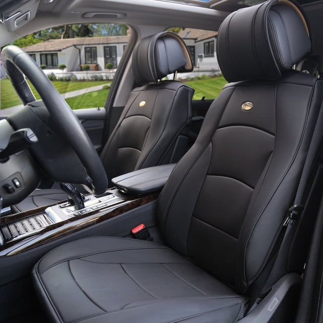Ultra Comfort High Grade Leather Seat Covers For Car Truck SUV Van - Front Set shown installed on front seats of a vehicle. The set includes two front bucket seat covers and two headrest covers made of top-quality faux leather backed with high-density foam and a non-slip silicone interior. The black seat covers feature a sleek design with a side-less structure for airbag compatibility, a top zipper opening, and elastic trim edges for a snug fit. Suitable for traditional and heated seats, these semi-custom covers require removable headrests for installation.