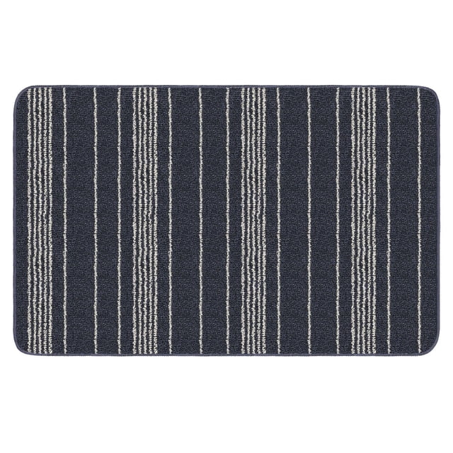 2-ft. x 3-ft. Denim Olin Carpet, a rectangular tufted polypropylene mat in dark denim blue with uniform gray vertical stripes, featuring a latex foam-gel backing to reduce slippage, machine washable and quick-drying, ideal as a durable accent rug protecting floors from dirt and debris.