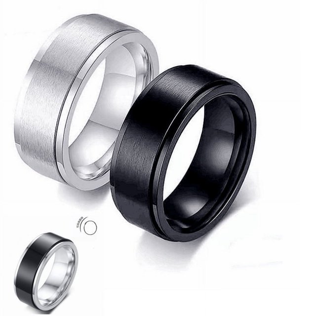 Rotatable Titanium Steel Ring Men's Stainless Steel Rotating Ring in black and silver finishes. The sleek black ring features a smooth, matte finish, while the silver ring has a brushed texture. Both rings showcase a rotatable design, crafted from durable titanium steel for long-lasting wear. Suitable as a stylish accessory for casual or formal occasions.