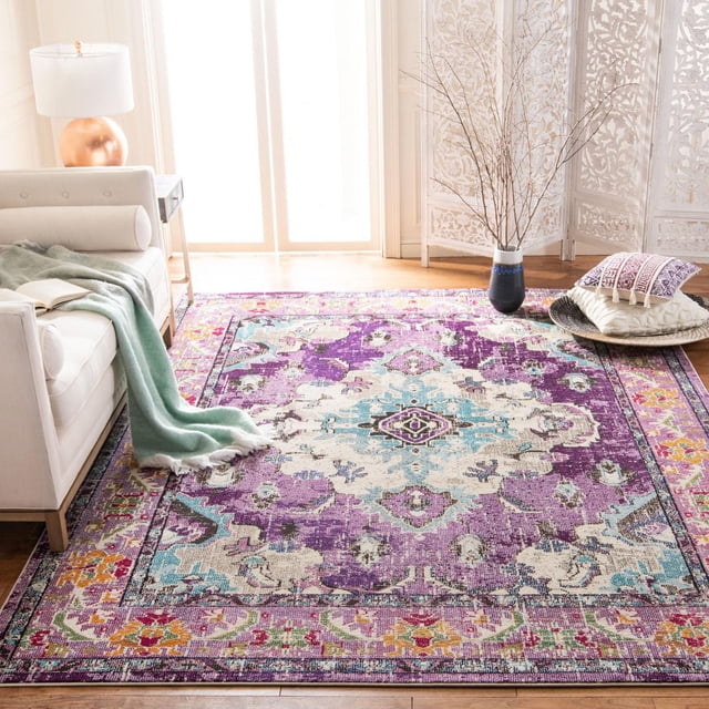 Safavieh Monaco Toria Traditional Area Rug in violet and light blue with a distressed Bohemian Persian design, power-loomed polypropylene with mixed pile textures, shown in a bright living room with a white sofa, green throw, and decorative pillows, ideal for adding vibrant style to home decor.