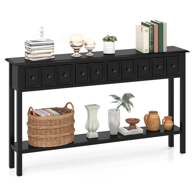 Gymax 60'' long narrow console table in black with 4 drawers and an open storage shelf. The table features a sleek design with a spacious tabletop displaying books, decorative items, and plants. The lower shelf holds a wicker basket, vases, and additional decor. Made of solid wood, MDF, and plywood, it includes an anti-tip kit and non-slip foot pads for safety. Ideal for hallways, living rooms, or behind sofas.