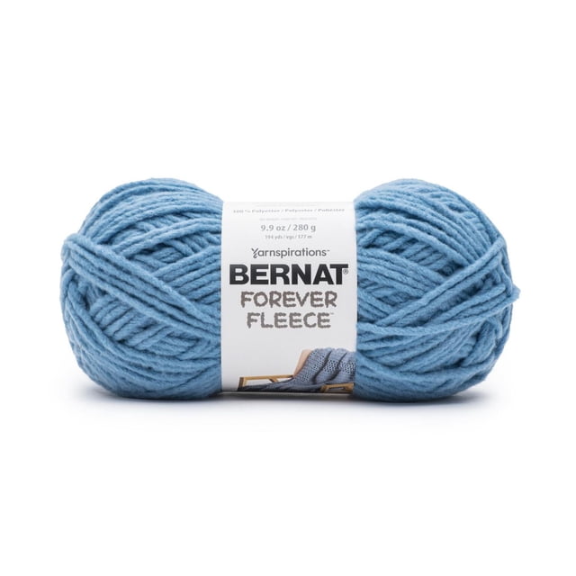 Bernat® Forever Fleece™ Yarn in light blue, a #6 super bulky polyester yarn ball weighing 9.9 oz (280 g) and 194 yards, with a soft fleecy texture visible, wrapped with a white label showing the brand and product name and a knitted blanket image, ideal for quick home decor projects.