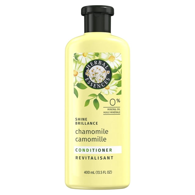 Herbal Essences Chamomile Shine Conditioner in a 400 mL pale yellow bottle with black flip-top cap, featuring chamomile flower graphics, mineral oil free formula that adds shine and revitalizes hair while being colour safe and pH balanced.