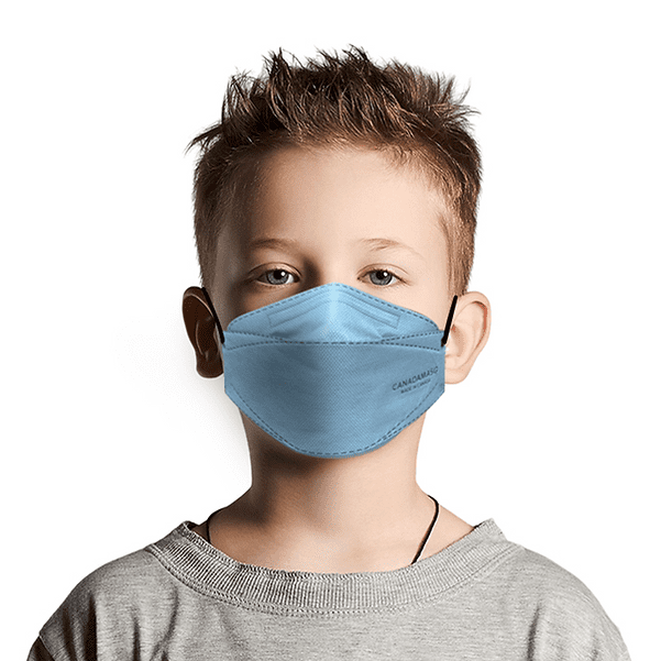 The Respirator CA N95 Flat Fold Small (Adult or Child) is shown being worn by a child. This disposable face mask features a flat-fold design for portability and a flexible nose bridge for a secure fit. It provides N95-level protection, filtering at least 95% of airborne particles, and is suitable for both medical and non-medical use. The mask is latex-free, graphene-free, hypoallergenic, and made in Canada. Dimensions are 7.4 x 3.14 inches (189 x 80 mm).