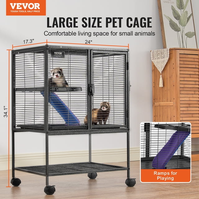 VEVOR 34" Metal Small Animal Cage 2-Tier Rolling Ferret Cage with Tray and Ramp. This black powder-coated metal cage measures 24"x17.3"x34.1" and features two levels connected by a non-slip, fabric-covered ramp. The cage includes a pull-out ABS tray for easy cleaning, lockable wheels for mobility, and a bottom storage shelf for pet supplies. Suitable for small animals like ferrets, chinchillas, guinea pigs, and hedgehogs. The narrow 1/2" wire spacing ensures safety and prevents escapes. The image shows two ferrets inside the cage, with a cozy indoor setting in the background.