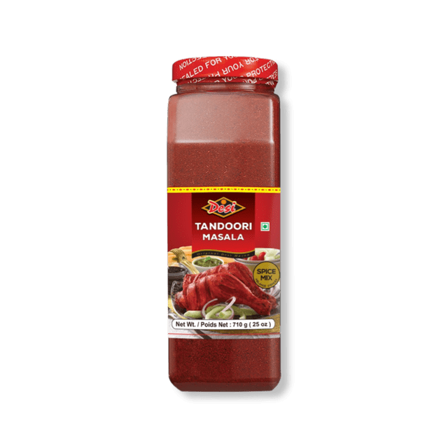Desi Tandoori Masala spice mix in a clear rectangular plastic container with a red screw cap, containing 710 g (25 oz) of finely ground red spice powder, labeled for Indian and South Asian cooking, ideal for curries, marinades, and tandoori dishes.