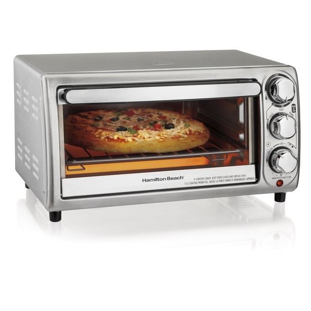 Hamilton Beach Stainless Steel Toaster Oven with 1,200 cu in capacity shown in a front 3/4 view baking a 9-inch pizza. It features a stainless steel finish, three chrome dials for temperature, timer, and cooking modes including bake, broil, toast, warm, and bagel. The oven includes two rack positions, a removable crumb tray, and a clear glass door, ideal for commercial or home kitchen countertop use. Its compact size is also suitable for reheating small meals or snacks.