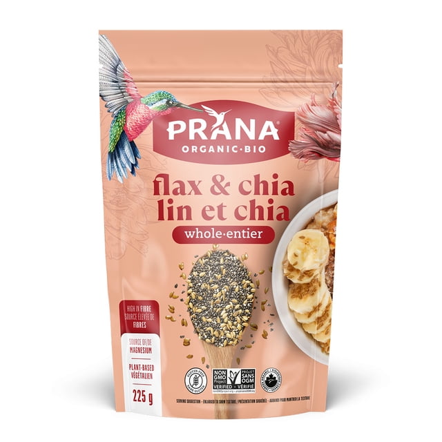 PRANAORGFLX&CHIA225G Prana organic flax and chia seeds 225g package with a pinkish-beige background, featuring a colorful hummingbird illustration on the top left and a bowl of sliced bananas and granola on the right, showing whole flax and chia seeds on a wooden spoon in the center, labeled high in fibre, source of magnesium, plant-based, non-GMO, and gluten-free, often used to boost nutrition in smoothies or baking recipes.