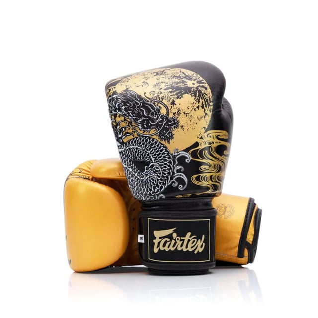 Fairtex Harmony Six - Limited Edition Gloves Without Packaging, featuring a Feng Shui-inspired design with intricate silkscreen detailing of a phoenix and dragon in black and gold tones. Made from genuine leather with triple-layered foam padding, these boxing gloves are ideal for training.