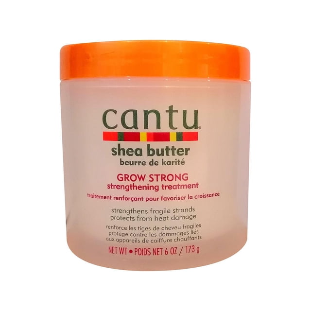 Cantu Shea Butter Grow Strong Strengthening Treatment in a translucent jar with an orange lid, formulated to strengthen fragile hair strands, protect from heat damage, and moisturize scalp and hair from roots to tips, ideal for adult hair care and chemical treatments.