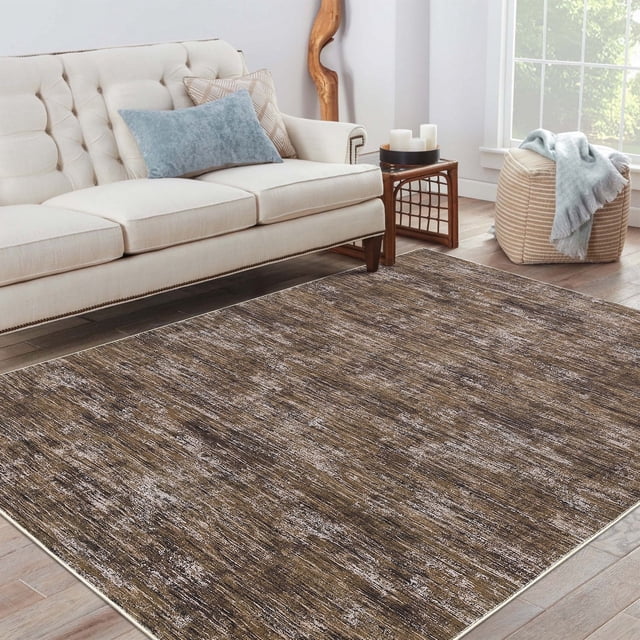 YUSAZENS 6x9 Modern Abstract Area Rug in brown with a low-pile design, displayed in a living room setting. The rug features an artistic abstract pattern and non-slip backing, suitable for high-traffic areas like dining rooms, home offices, and bedrooms. Its foldable and easy-to-clean construction makes it ideal for families with kids and pets.