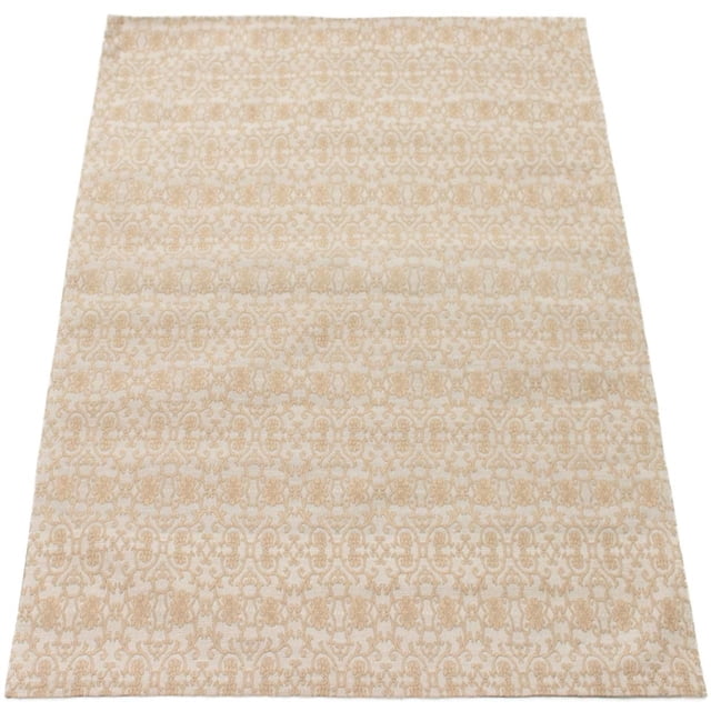 Beige and cream rectangular area rug featuring a detailed symmetrical floral and vine pattern with a flat texture, ideal as an accent rug for indoor living or dining spaces.