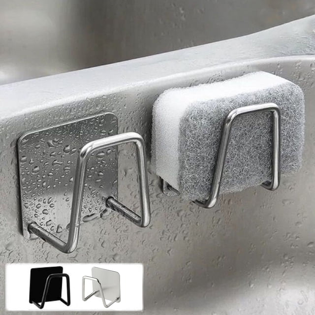 Vaidha Kitchen 304 Stainless Steel Sponges Self Adhesive Sink Sponge Drainer Drying Rack. A compact U-shaped sponge holder made of 304 stainless steel with a brushed finish, mounted on a sink using adhesive backing. Designed for storing sponges, dishcloths, or steel balls, it measures 4.5 x 4.5 x 3.3 cm and supports up to 3-5 kg. The image shows the holder attached to a wet sink surface, holding a sponge. Available in black and white.