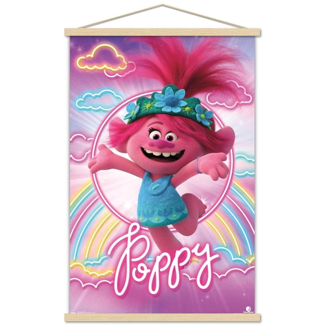 DreamWorks Trolls 2 - Poppy Wall Poster, 22.375" x 34" framed, showing Poppy, a pink troll with bright pink hair in a high ponytail, wearing a blue dress and green floral headband. The background has neon-style clouds and a rainbow on a purple-pink gradient. The name 'Poppy' appears in white cursive text at the bottom. The poster is framed in light wood with a hanging string, ideal for bedroom or playroom decor.