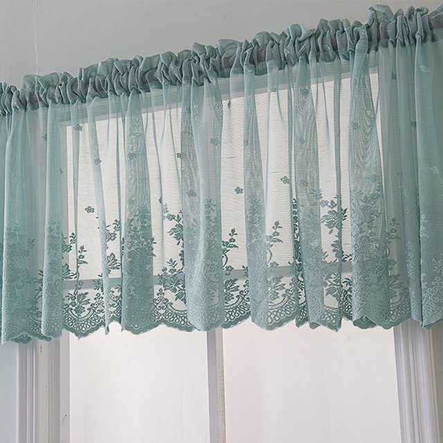 Lace Cafe Kitchen Ruffle Window Valance in a semi-transparent voile fabric, featuring a delicate lace design with floral patterns. The curtain is styled with a ruffled top and Roman blinds aesthetic, ideal for adding a pastoral and romantic touch to kitchens, living rooms, or bedrooms. Shown in a soft, light-colored fabric, it enhances ventilation and provides an elegant window treatment.