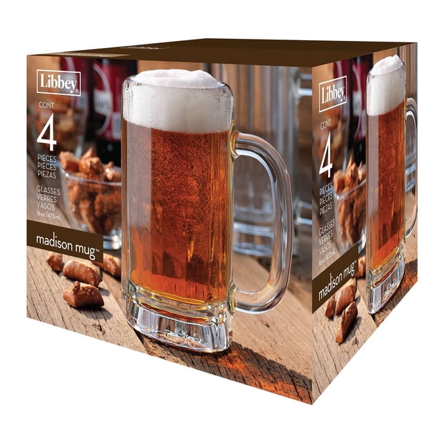 Libbey Madison Beer Mug Set - 4 Pieces with four clear glass mugs featuring sturdy handles and thick bases, each holding 16 oz/473 ml of amber beer topped with frothy foam, displayed on a wooden surface with snacks, ideal for serving lagers, pilsners, or IPAs at home.