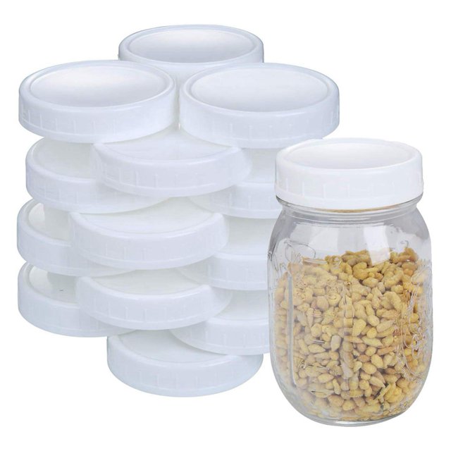 48X regular mouth lids for mason jars, featuring white plastic storage caps with a 70mm diameter. The image shows a stack of reusable lids alongside a mason jar filled with dried food, demonstrating their use for airtight storage. These versatile lids are compatible with Ball, Kerr, and Bernardin jars, ideal for preserving, organizing, and gifting. Designed with ribbed edges for easy grip and leak-proof sealing, they are dishwasher-safe and suitable for pantry, fridge, and freezer storage.