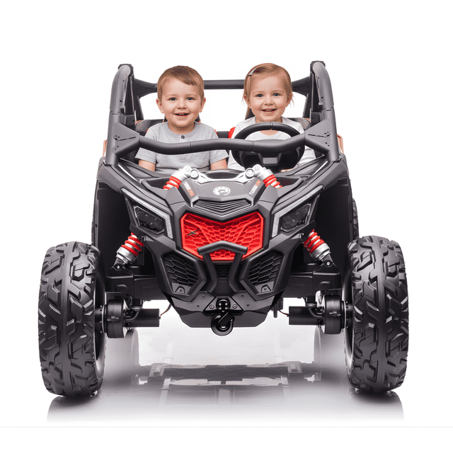 KidsVIP 2x24V Can-Am Maverick RS 2 Seater 4x4 Ride On UTV Buggy with Rubber Wheels, Music & Remote. A front-facing view of the black and red ride-on buggy featuring oversized 14-inch EVA rubber wheels, eco-leather seats for two riders with seat belts, and a detailed grille design. Designed for kids aged 3-6, it includes a 2.4GHz parental remote, USB and SD card inputs, and bright LED lights. Suitable for outdoor play on various terrains, supporting up to 120 lbs and reaching speeds of 8-11 km/h.