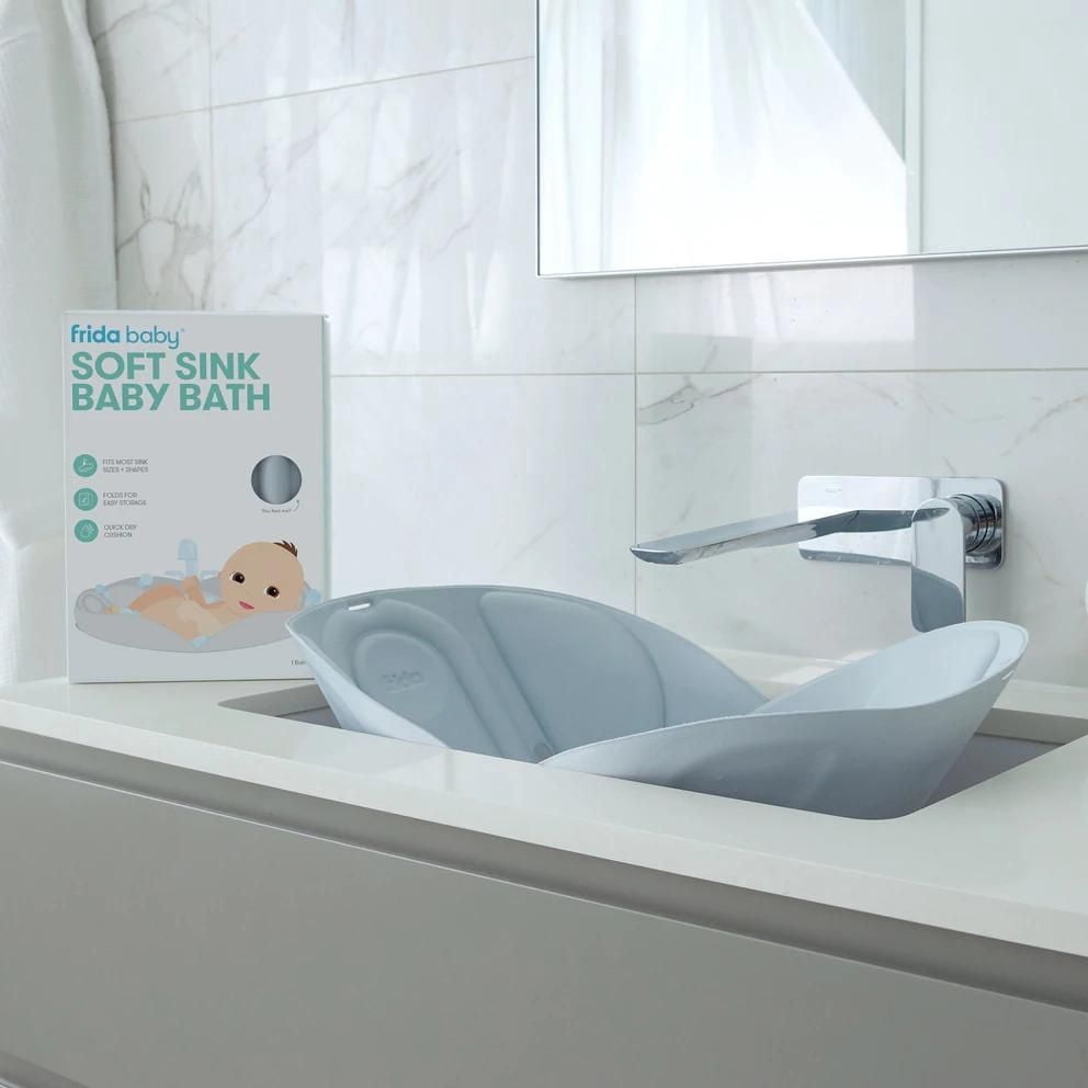 Frida Baby - Soft Sink Baby Bath - Easy To Clean Baby Bathtub + Bath Cushion That Supports Baby's Head - Quick Dry Material - Machine Washable