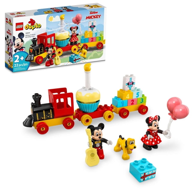 LEGO DUPLO Disney Mickey & Minnie Birthday Train 10941 features a 3-section buildable train with a black and red engine, cupcake car with candle, and colorful number block car. Includes Mickey Mouse with yellow guitar, Minnie Mouse holding pink balloons, and Pluto the dog, ideal for toddlers 2+ to develop fine motor and imaginative skills.