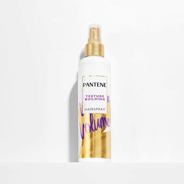 PANTENE Pro-V Volume Texture Hair Spray in a white bottle with gold spray nozzle and purple and gold label text, formulated to add texture, volume, flexible hold, and control frizz and flyaways for smooth, touchably soft hair styling.